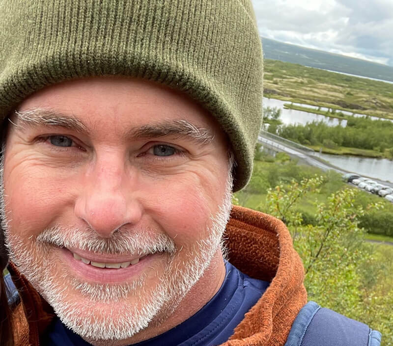 Todd Votteler with green landscape in the background.