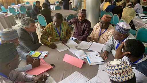 Men collaborating at table